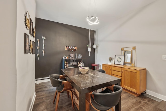 75 Poplar St, Jersey City, NJ 07307 - dining room featuring dark wood finished floors and a baseboard heating unit
