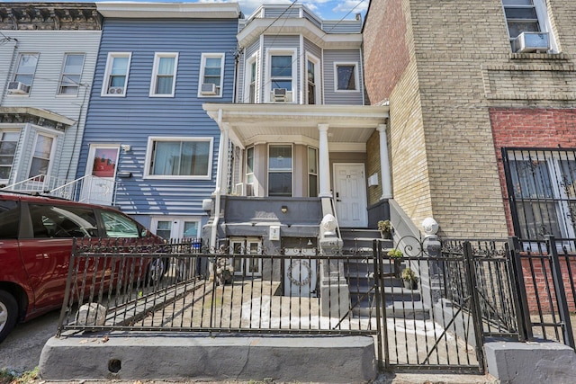 75 Poplar St, Jersey City, NJ 07307 - townhome / multi-family property with a fenced front yard and cooling unit