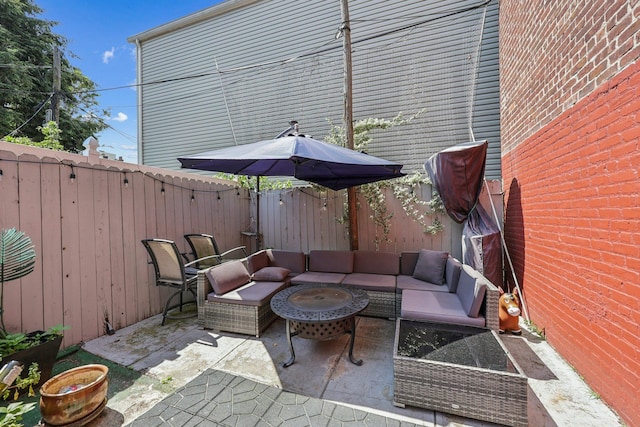 75 Poplar St, Jersey City, NJ 07307 - fenced backyard featuring outdoor lounge area and a patio