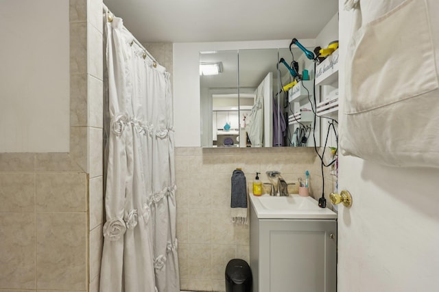 75 Poplar St, Jersey City, NJ 07307 - full bathroom featuring vanity, tile walls, and a shower with curtain