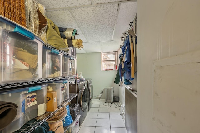 75 Poplar St, Jersey City, NJ 07307 - laundry room featuring independent washer and dryer, radiator, and light tile patterned flooring