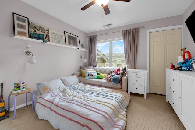 carpeted bedroom featuring ceiling fan