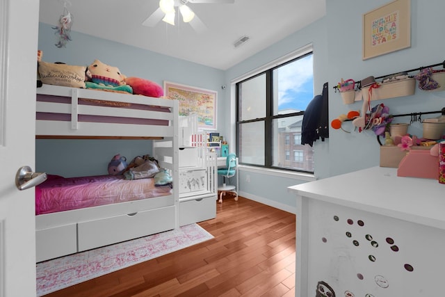 bedroom featuring ceiling fan and light hardwood / wood-style flooring