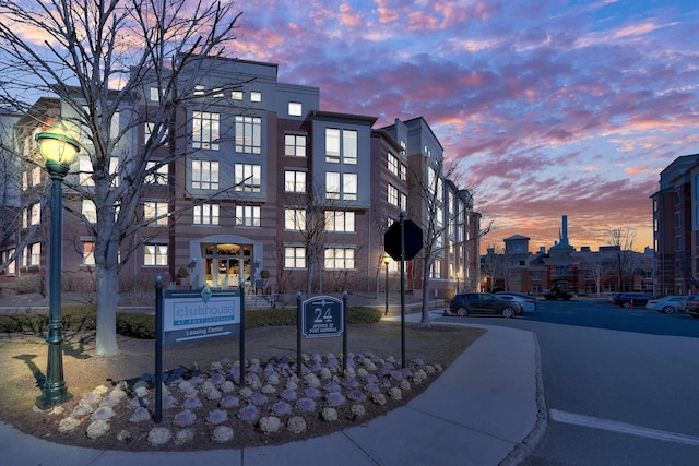 view of outdoor building at dusk