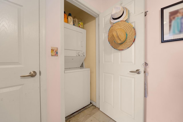 laundry area with stacked washing maching and dryer