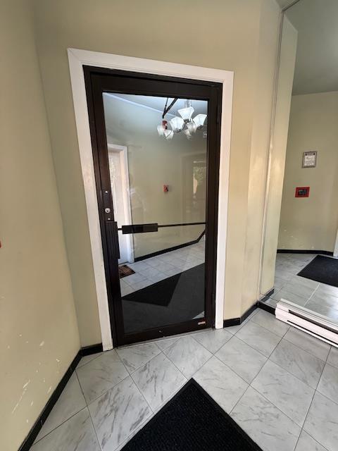 603 55th St Unit 204, West New York, NJ 07093 - doorway featuring baseboards