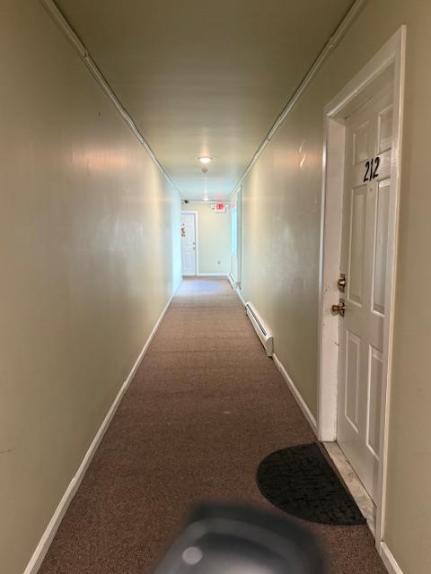 603 55th St Unit 204, West New York, NJ 07093 - corridor with baseboard heating, carpet, and baseboards