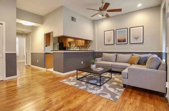 187 Wayne St Unit 208C, Jersey City, NJ 07302 - living area featuring ceiling fan, light wood-style floors, a high ceiling, and recessed lighting