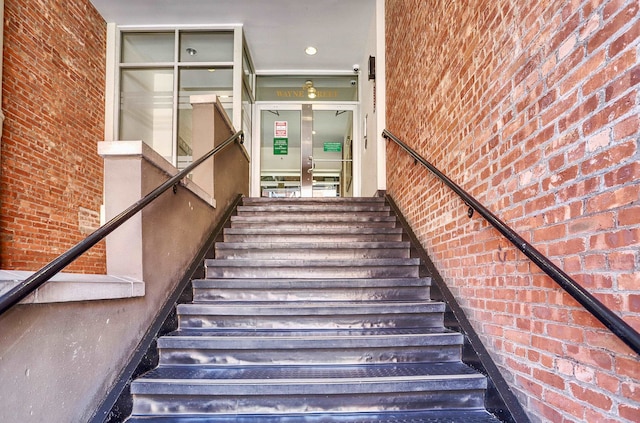 187 Wayne St Unit 208C, Jersey City, NJ 07302 - stairway with brick wall