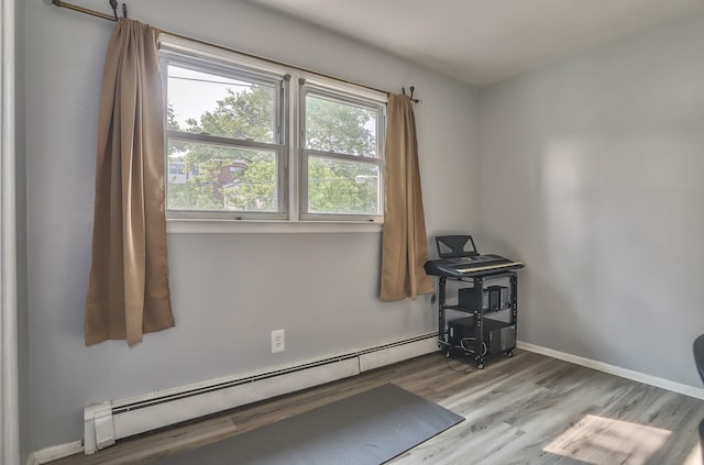 252 N St # 201, Jersey City, NJ 07307 - unfurnished room featuring a baseboard radiator and wood finished floors