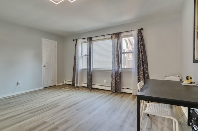 252 N St # 201, Jersey City, NJ 07307 - office area with light wood-style flooring and a baseboard radiator