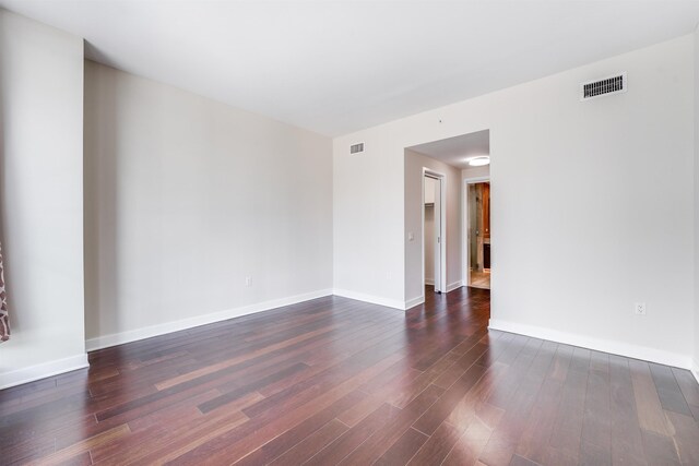 empty room featuring dark hardwood / wood-style floors