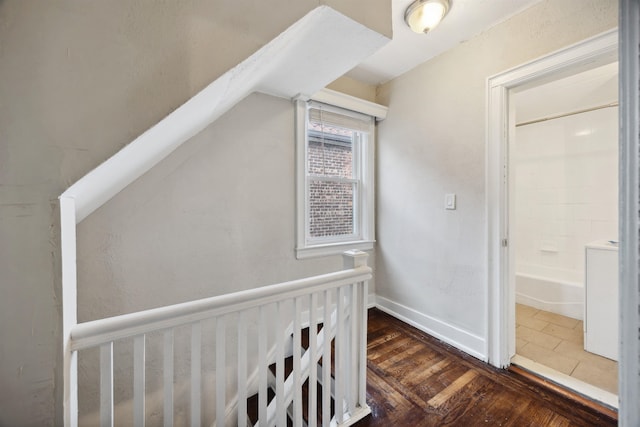 corridor featuring dark wood-type flooring