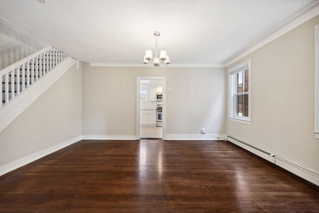 interior space featuring a chandelier, ornamental molding, dark wood-type flooring, and a baseboard heating unit