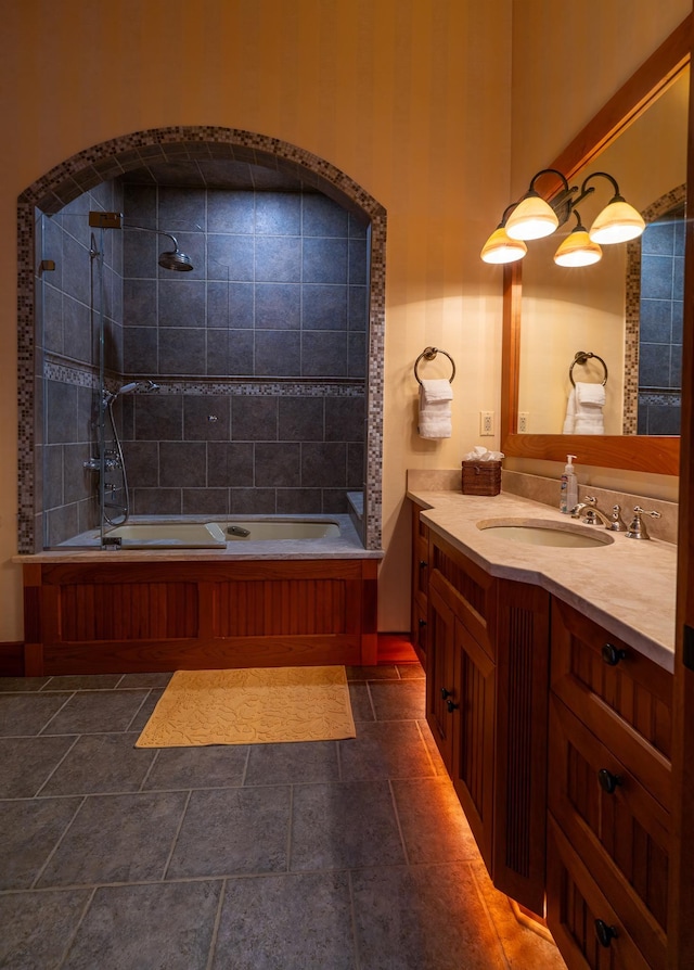 bathroom featuring vanity and tiled shower / bath combo