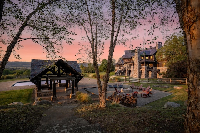 view of community featuring a gazebo and an outdoor fire pit