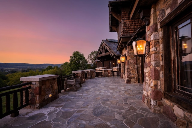 patio terrace at dusk with a mountain view