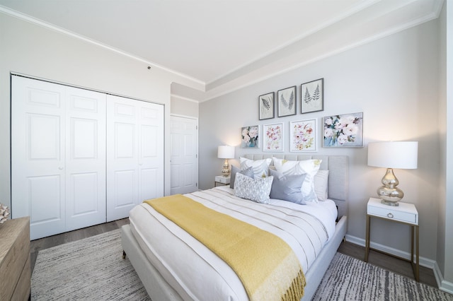 20 2nd St Unit 2503, Jersey City, NJ 07302 - bedroom with wood finished floors, a closet, and ornamental molding