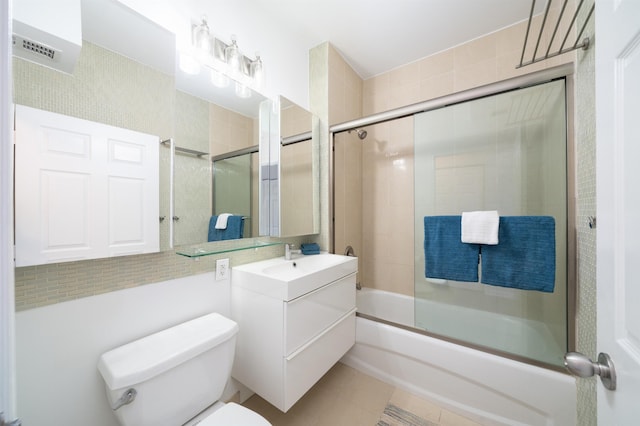 20 2nd St Unit 2503, Jersey City, NJ 07302 - bathroom with bath / shower combo with glass door, toilet, vanity, and tile patterned floors