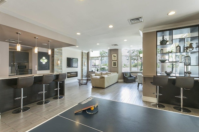 20 2nd St Unit 2503, Jersey City, NJ 07302 - game room featuring crown molding, recessed lighting, baseboards, and light wood-style floors