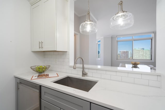 20 2nd St Unit 2503, Jersey City, NJ 07302 - kitchen with a sink, dishwashing machine, gray cabinets, tasteful backsplash, and light stone counters