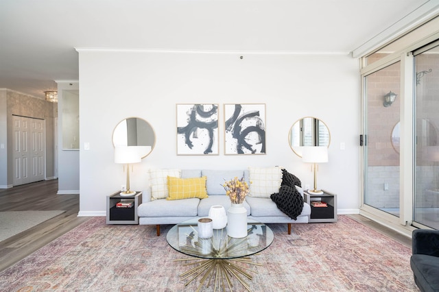 20 2nd St Unit 2503, Jersey City, NJ 07302 - living room with ornamental molding, wood finished floors, and baseboards
