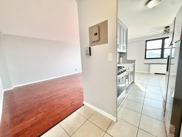1225 Kennedy Blvd Unit 5E, Bayonne, NJ 07002 - corridor with baseboards, electric panel, and light tile patterned floors