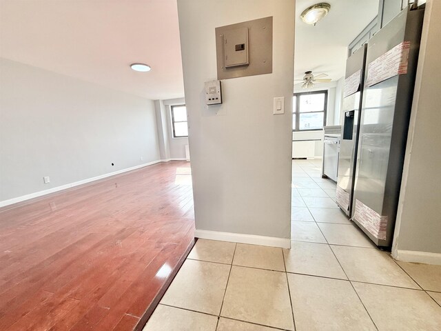 1225 Kennedy Blvd Unit 5E, Bayonne, NJ 07002 - hallway with electric panel, baseboards, and light wood finished floors