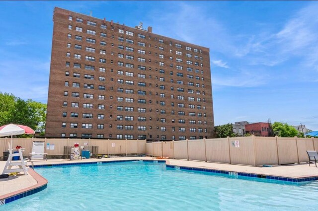 1225 Kennedy Blvd Unit 5E, Bayonne, NJ 07002 - community pool featuring a patio