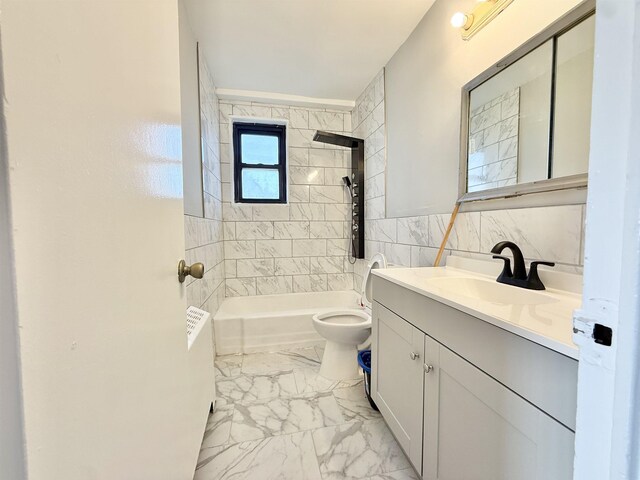1225 Kennedy Blvd Unit 5E, Bayonne, NJ 07002 - bathroom with vanity, toilet, marble finish floors, shower / bathtub combination, and tile walls