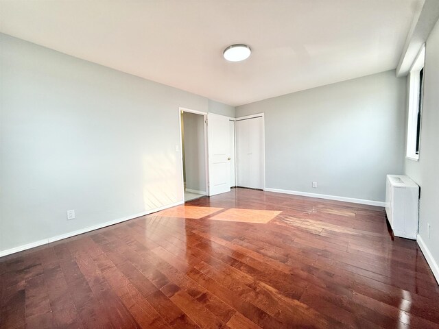 1225 Kennedy Blvd Unit 5E, Bayonne, NJ 07002 - unfurnished bedroom featuring hardwood / wood-style floors and baseboards