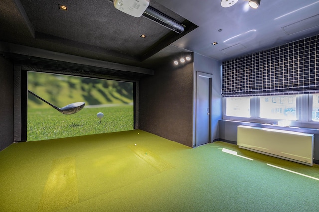 88 Morgan St Unit 802, Jersey City, NJ 07302 - game room with golf simulator, radiator, and carpet floors