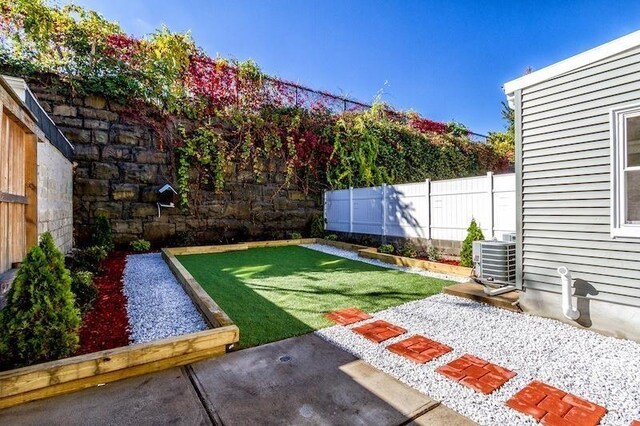385 1st St, Jersey City, NJ 07302 - view of yard featuring central AC and a patio