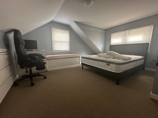 bedroom with carpet flooring and vaulted ceiling