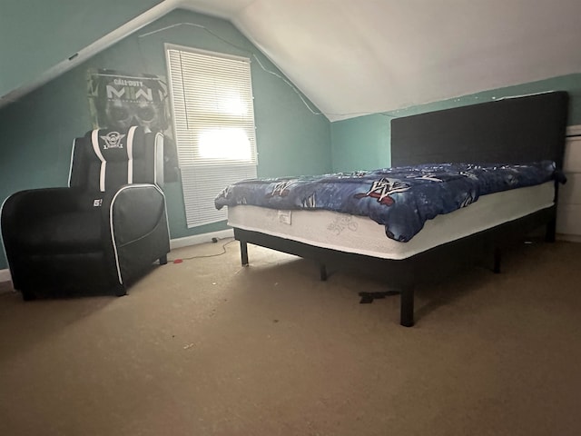 bedroom featuring carpet flooring and vaulted ceiling