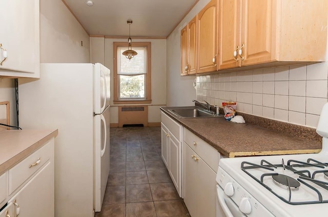 101 Kensington Ave Unit A5, Jersey City, NJ 07306 - kitchen featuring radiator heating unit, a sink, white appliances, backsplash, and dark tile patterned floors