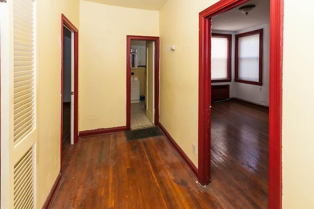 corridor featuring dark hardwood / wood-style floors