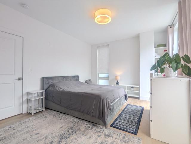 bedroom with wood finished floors