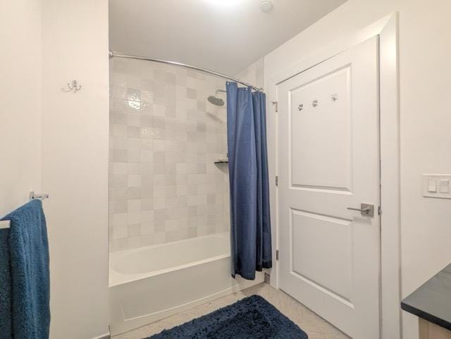 bathroom featuring shower / tub combo and tile patterned floors