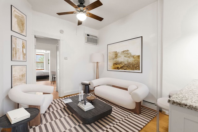 50 Bright Street 1L Or 101, Jersey City, NJ 07302 - living area featuring light wood finished floors, an AC wall unit, a ceiling fan, and a baseboard heating unit