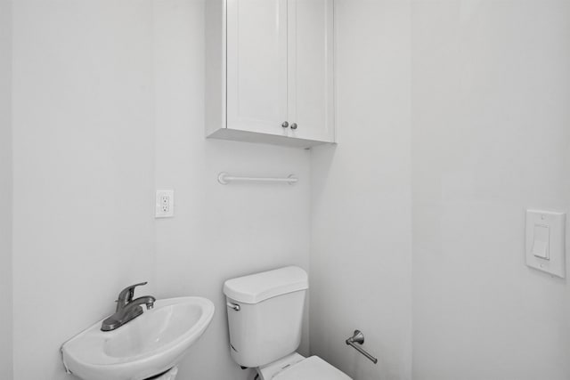 227 Bay St Unit 4B, Jersey City, NJ 07302 - half bathroom featuring a sink and toilet