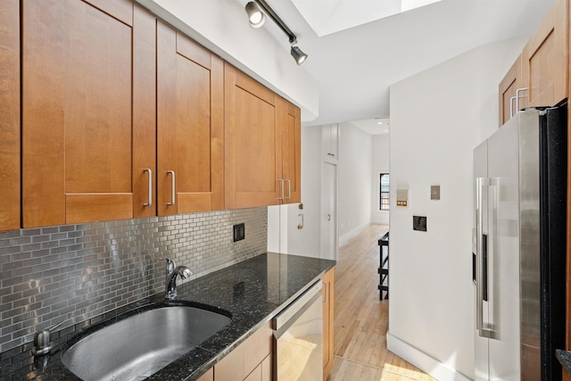 227 Bay St Unit 4B, Jersey City, NJ 07302 - kitchen featuring fridge with ice dispenser, dishwasher, decorative backsplash, dark stone countertops, and light wood-style flooring