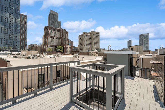 227 Bay St Unit 4B, Jersey City, NJ 07302 - wooden terrace with a skyline view