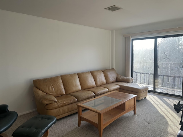 living area with carpet floors and visible vents