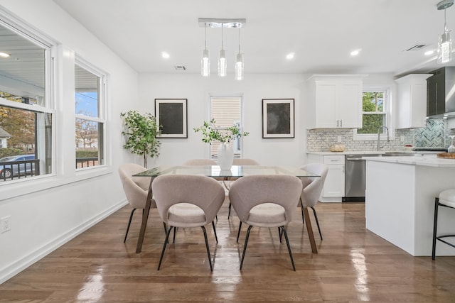 dining space featuring dark hardwood / wood-style flooring