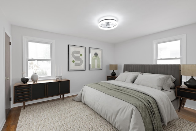 64 W 57th St, Bayonne, NJ 07002 - bedroom with multiple windows and light wood finished floors