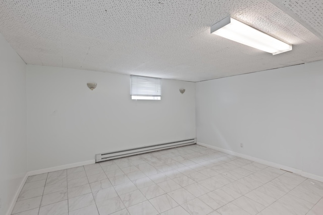 64 W 57th St, Bayonne, NJ 07002 - below grade area featuring a baseboard heating unit and baseboards