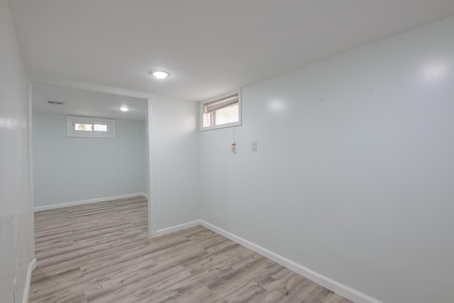 64 W 57th St, Bayonne, NJ 07002 - below grade area with light wood-type flooring and baseboards