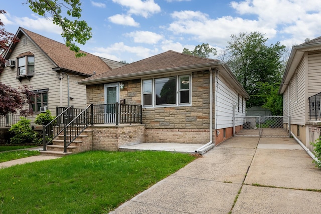 64 W 57th St, Bayonne, NJ 07002 - view of front facade featuring stone siding and roof with shingles