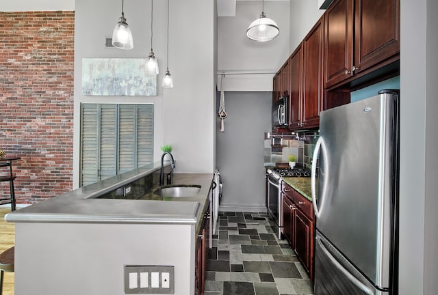 518 Gregory Ave Unit 412A, Weehawken, NJ 07086 - kitchen featuring brick wall, a towering ceiling, pendant lighting, a sink, and stainless steel appliances